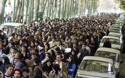 Iranian students walk during a demonstration  entitled: 'The anti-dictatorship gathering of students' at Tehran University Saturday Dec. 7, 2002. Thousands of students called for a nation-wide referendum to get Iran out of a political deadlock where unelected hard-liners have used the courts they control as a political instrument to stall voted presidential reforms. (AP Photo/Hasan Sarbakhshian)